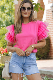 Blusa de tul rosa con mangas con volantes
