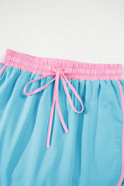 Conjunto de 2 piezas de camiseta y falda pantalón con hombros caídos y borde en bloques de color turquesa