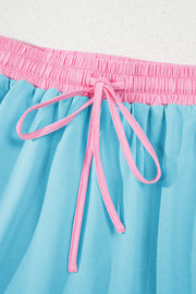 Conjunto de 2 piezas de camiseta y falda pantalón con hombros caídos y borde en bloques de color turquesa