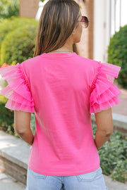 Blusa de tul rosa con mangas con volantes