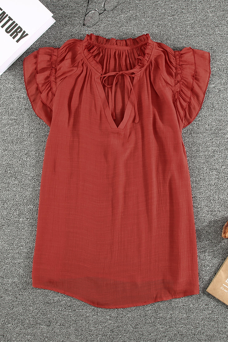 Haut à volants et col en V avec cordon de serrage