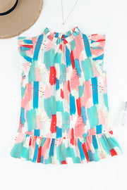 Top con volantes y cuello alto en color rosa