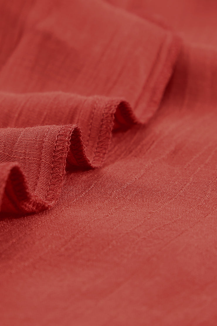 Haut à volants et col en V avec cordon de serrage