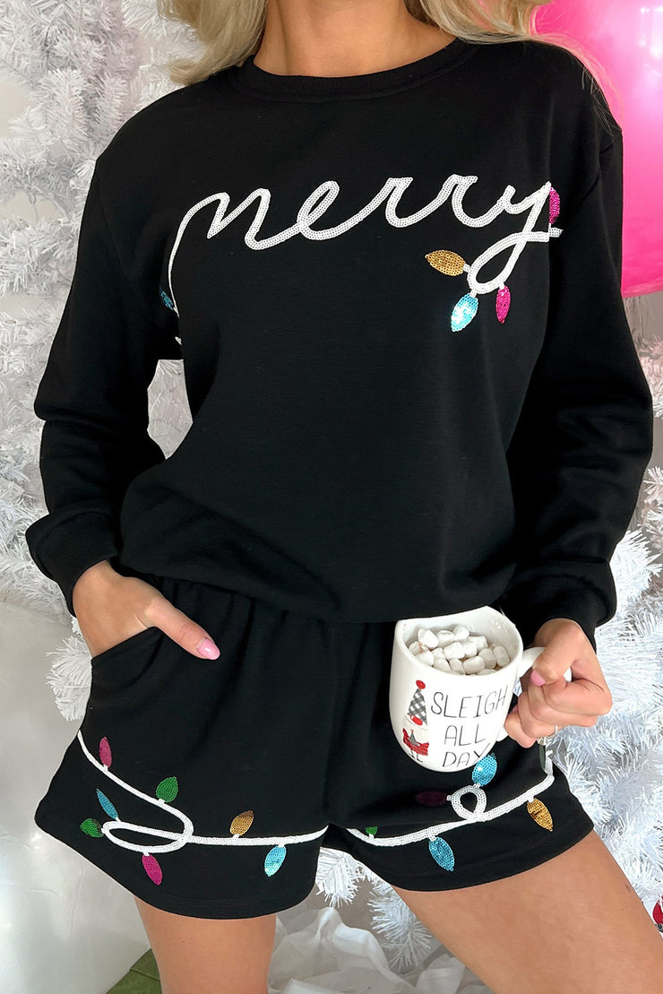 Ensemble pull et short à paillettes noires et motif joyeux