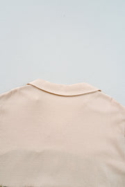 Mini-robe noire en maille gaufrée à carreaux, col en V, grande taille