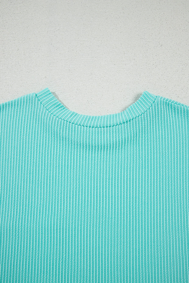 Camiseta de cuello redondo con bolsillos y bloques de color de punto acordonado en azul claro