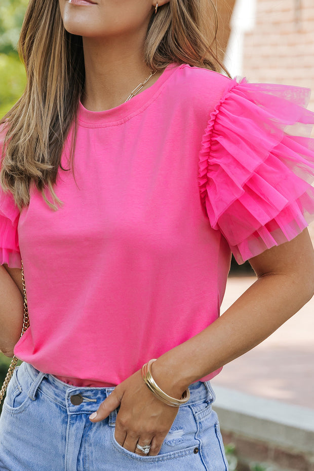 Blusa de tul rosa con mangas con volantes